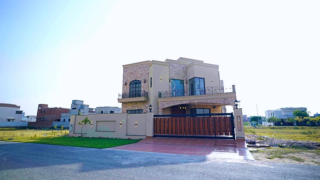 1 Kanal Designer House in DHA Phase 7 | Stone Exterior, Full Basement & Double Lawns 2