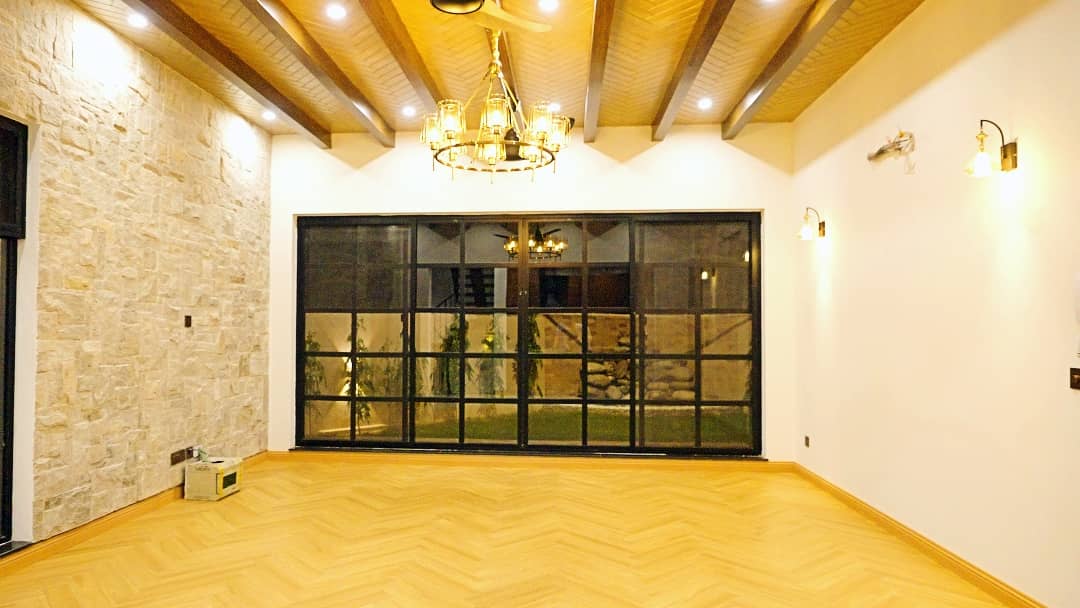 1 Kanal Designer House in DHA Phase 7 | Stone Exterior, Full Basement & Double Lawns 14