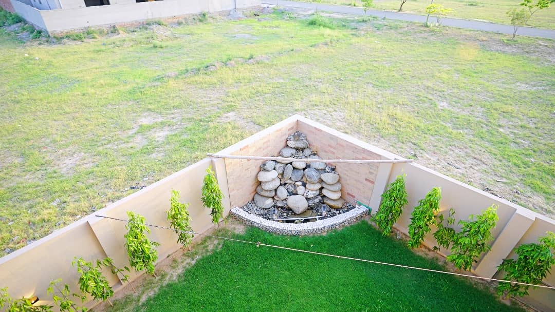 1 Kanal Designer House in DHA Phase 7 | Stone Exterior, Full Basement & Double Lawns 16