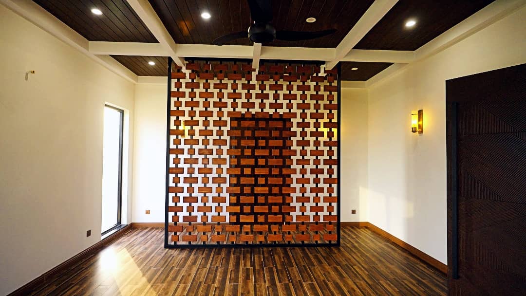 1 Kanal Designer House in DHA Phase 7 | Stone Exterior, Full Basement & Double Lawns 32